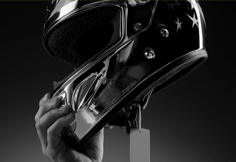 Sculptural motorcycle helmet in dramatic studio lighting
